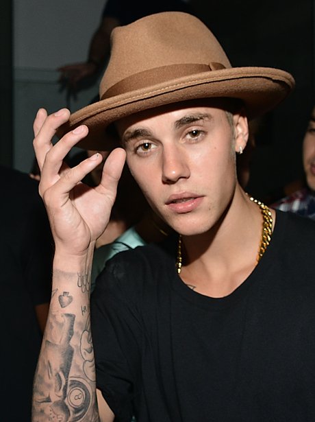 Taking a leaf out of Pharrell's book? Justin Bieber rocks a hat at the