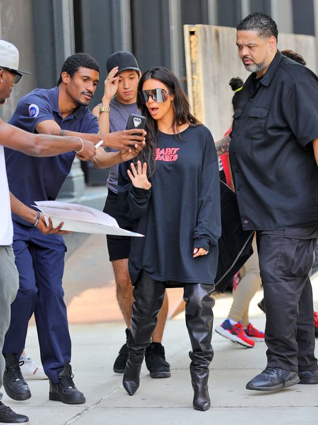 OWNING IT. Kim Kardashian wears Pablo jumper and over the knee boots